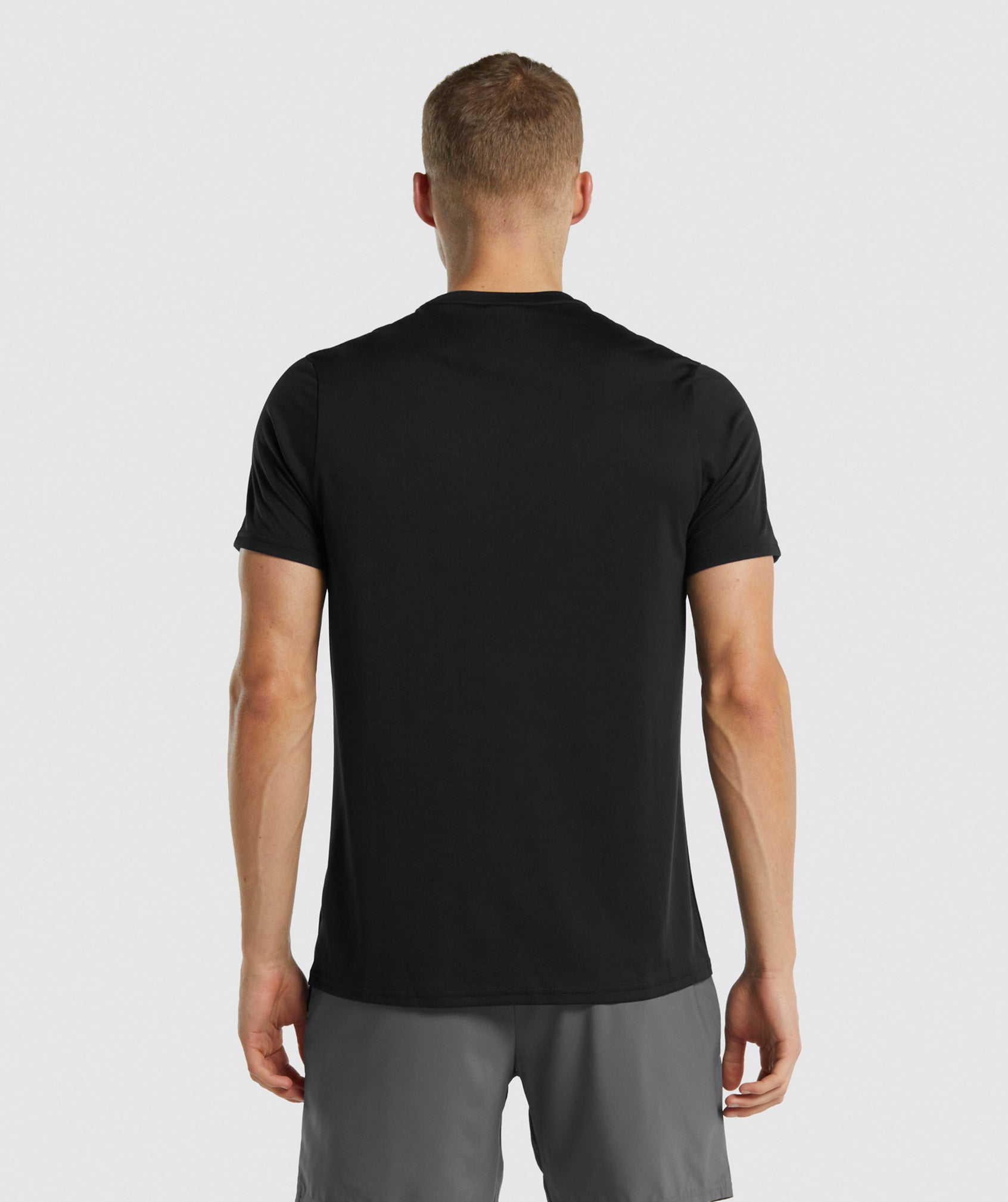 Black Men's Gymshark Arrival Regular Fit T Shirts | FTQHNW-972