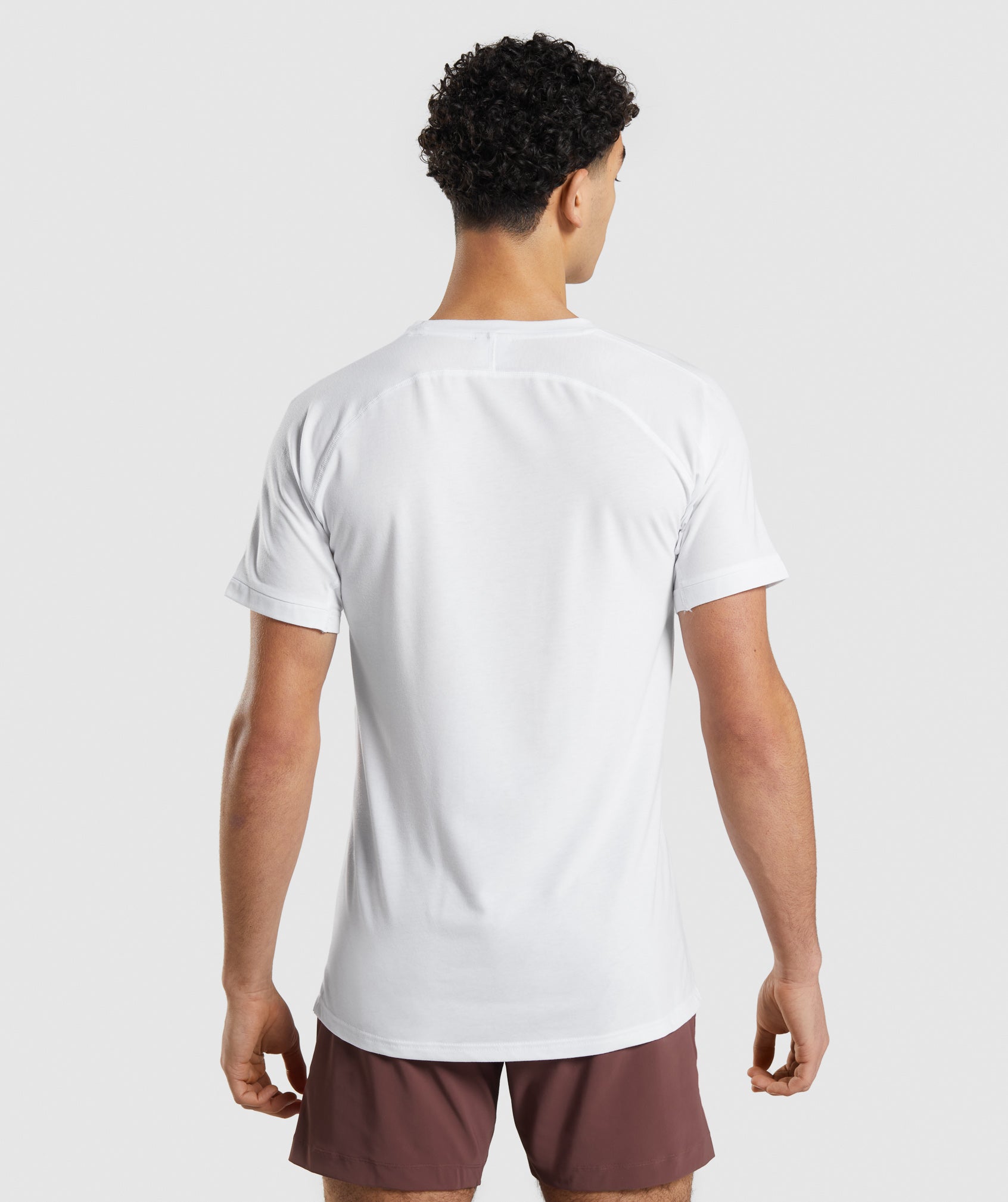 White Men's Gymshark Studio Amplify T Shirts | ANUGSV-947